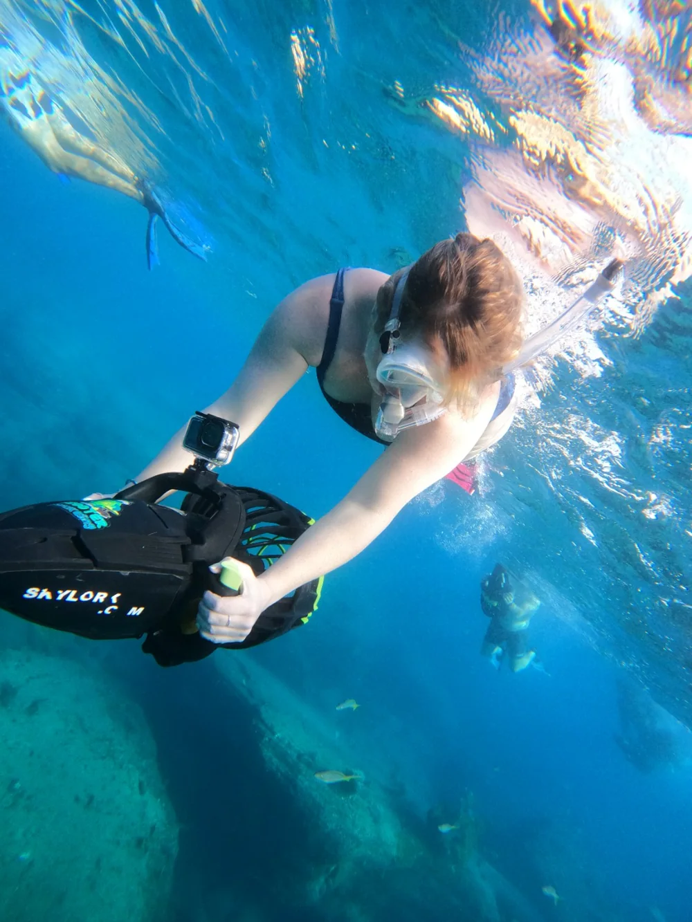 Guest exploring underwater with a Skylork sea scooter