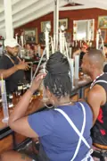 Guests working at the Academy of Rum distilling stations