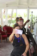 Two Academy of Rum guests posing with a bottle label