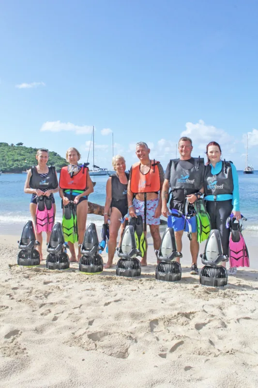 Snorkeler holding a powered sea scooter underwater in Antigua