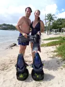 Two guests with snorkeling equipment and sea scooters on Galleon Beach
