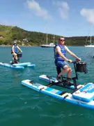 Two Sea Cycle guests riding across the harbour