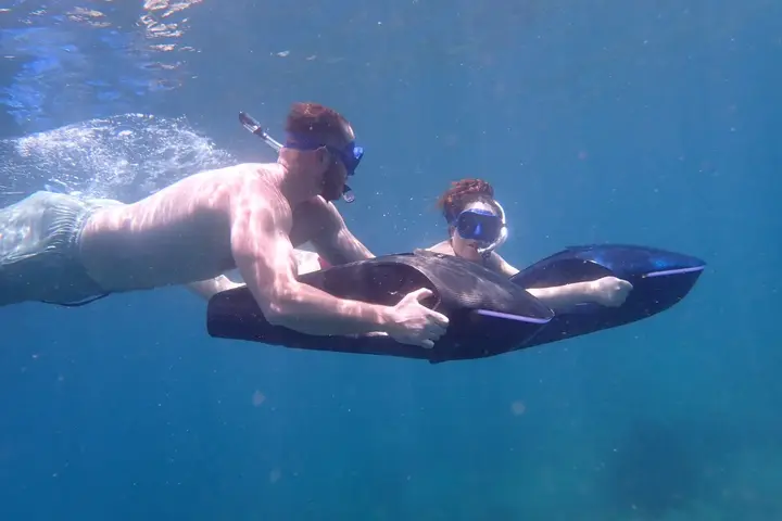 Guests swimming side by side with SeaNXT ocean jets