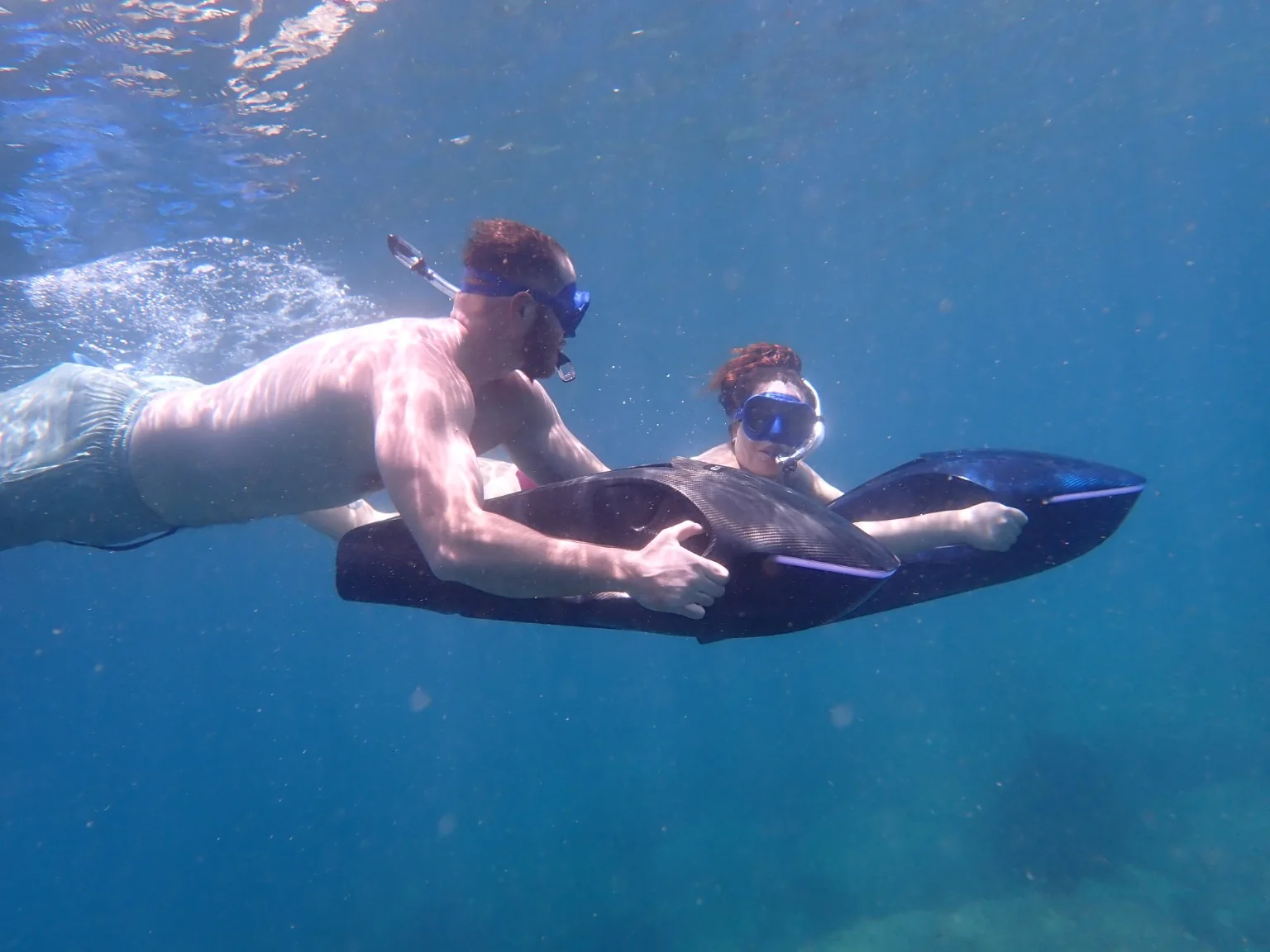 Guests swimming side by side with SeaNXT ocean jets
