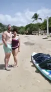 Guests standing on the beach beside SeaNXT equipment