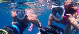 Group of snorkelers tour underwater with their Seadoo RS1 underwater scooters in Antigua